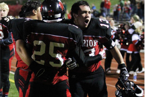 Senior running back Lane Yates celebrates with senior wide receiver and cornerback Jamaal Conway-Smith during a _____ game against ____. Yates and Conway-Smith are both headed to Wayne State for football next year. 