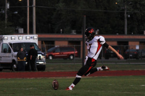 Senior kicker Christian Hagan kicks off during a Westside football game against Fremont _____. Hagan will be going to NIU on scholarship to kick. 